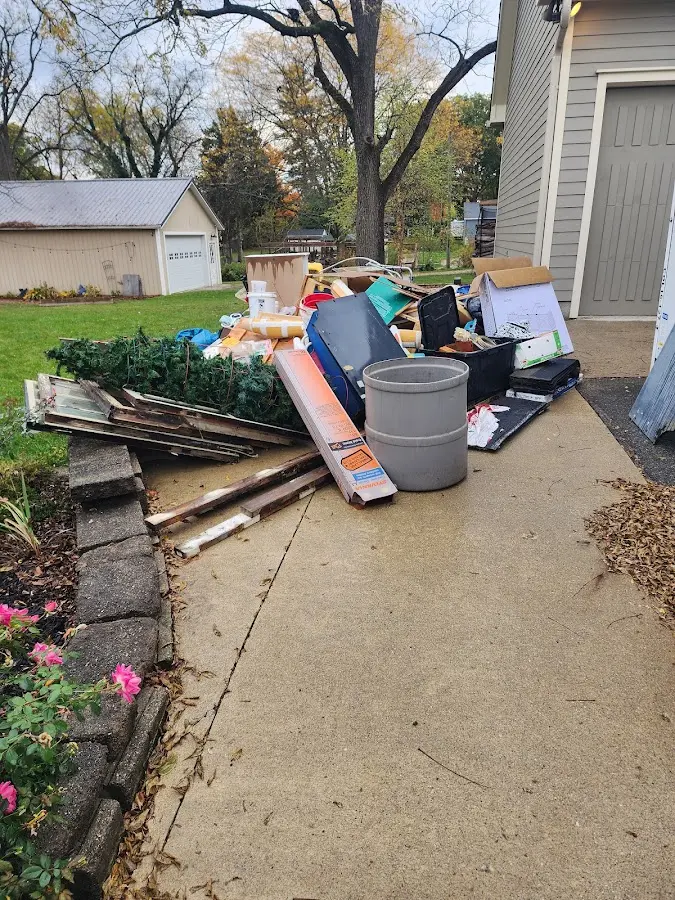 Dumpster being loaded with debris for 10 Yard Dumpster Rental in Penbrook